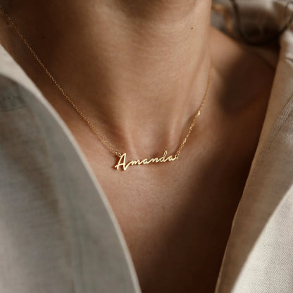 Minimal Script Name Necklace in 18K gold finish on neckline, personalized cursive name pendant with delicate chain, elegant everyday jewelry by Aishwaryam Jewel